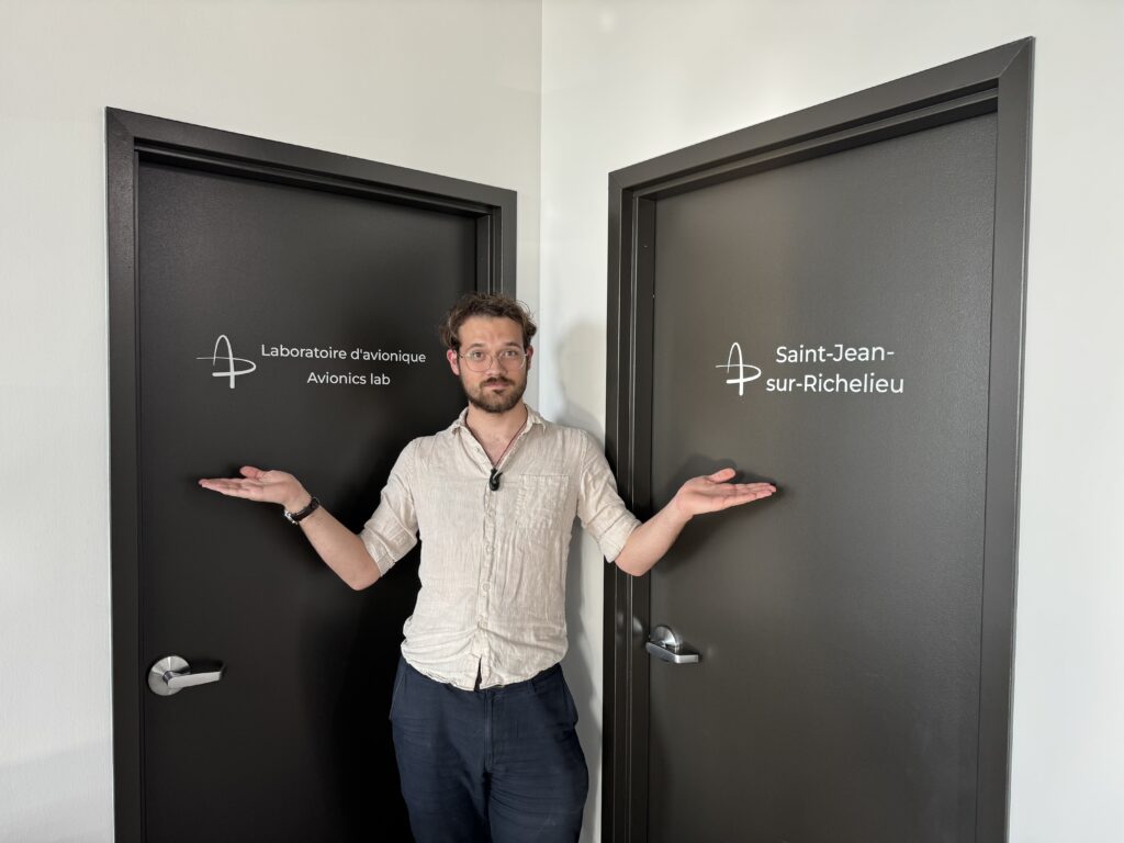 Luke Roeven at Reaction Dynamics standing between two doorsways. 